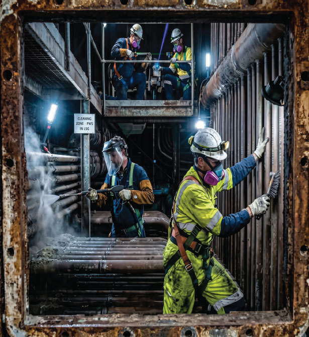 Industrial boiler maintenance workers
