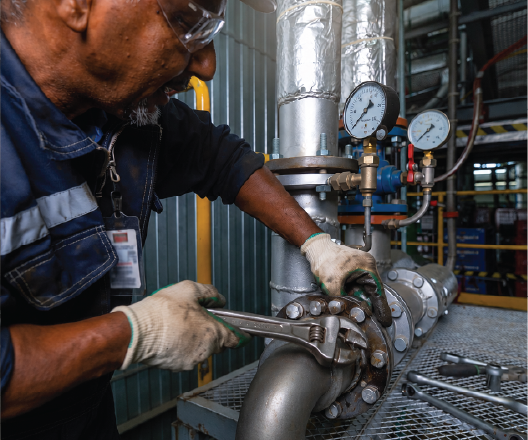 Industrial boiler maintenance worker